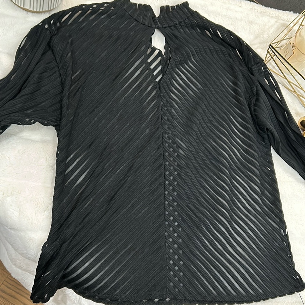 Black long sleeve shirt with button on back